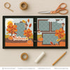 Autumn scrapbook page kit artwork with yellow sun, orange leaf die cuts, yellow leaf die cuts, rust leaf die cuts, Autumn script title, teal damask pattern, brown damask pattern, orange polka dot paper. Designed for Autumn Memories Scrapbook Kit, Fall Leaves Scrapbook Layout, mustard branch pattern, pale blue background, brown photo mats, layered fall landscape, white die cut outlines, two page autumn layout, coordinated fall embellishments, orange autumn trees, yellow and red leaves.