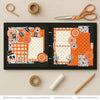 Spooky Fun scrapbook page kit shown in a memory album binder mockup with the finished two-page layout. A coordinated way to preserve Halloween memories and favorite photos.