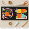 Witch Way To The Candy scrapbook page kit shown in a memory album binder mockup with the finished two-page layout. A coordinated way to preserve Halloween candy memories and favorite photos.
