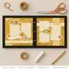 You Bring The Sunshine scrapbook page kit artwork with mustard polka dots, white cross pattern, sunflower floral pattern, large sunflower clusters, small sunflower blossoms, curved sentiment banner, you bring the sunshine phrase, layered floral embellishments. Designed for Yellow Floral Scrapbook Kit, Happy Memories Scrapbook Pages, white photo mats, two page floral layout, golden yellow sunflowers, green leafy stems, mustard yellow palette, yellow gingham pattern, white polka dots.