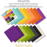 Chills and Thrills Premium monthly box. coordinating 12x12 cardstock sheets spread out to show the full bright Halloween palette.