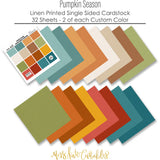 Pumpkin Season Cardstock, papers spread out image, showing 12x12 printed smooth cardstock for scrapbook page bases, photo mats, card making, die cutting, titles, borders, and layered paper projects. Buyer theme: Cozy Autumn Printed Smooth Cardstock 12x12. Printed smooth cardstock in coordinating fall colors including teal, orange, cream, green, mustard, and warm harvest tones. Visible artwork includes sweaters, blankets, autumn leaves, acorns