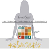 Pumpkin Season Cardstock, size guide image, showing 12x12 printed smooth cardstock for scrapbook page bases, photo mats, card making, die cutting, titles, borders, and layered paper projects. Buyer theme: Cozy Autumn Printed Smooth Cardstock 12x12. Printed smooth cardstock in coordinating fall colors including teal, orange, cream, green, mustard, and warm harvest tones. Visible artwork includes pie slices, sweaters, blankets, autumn leaves