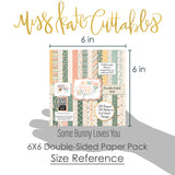 Some Bunny Loves You 6x6 Double-Sided Paper Pack, size guide shown in hand for scale, showing 6x6 scrapbook paper for handmade cards, mini albums, junk journals, paper layering, small-scale layouts, and coordinated paper crafts. Buyer theme: Easter 6x6 Paper for Cards & Mini Albums. Some Bunny Loves You 6x6 Double-Sided Paper Pack with scaled bunnies, Easter eggs, tulips, carrots, florals, plaid, stripes and polka dots for cards and mini albums